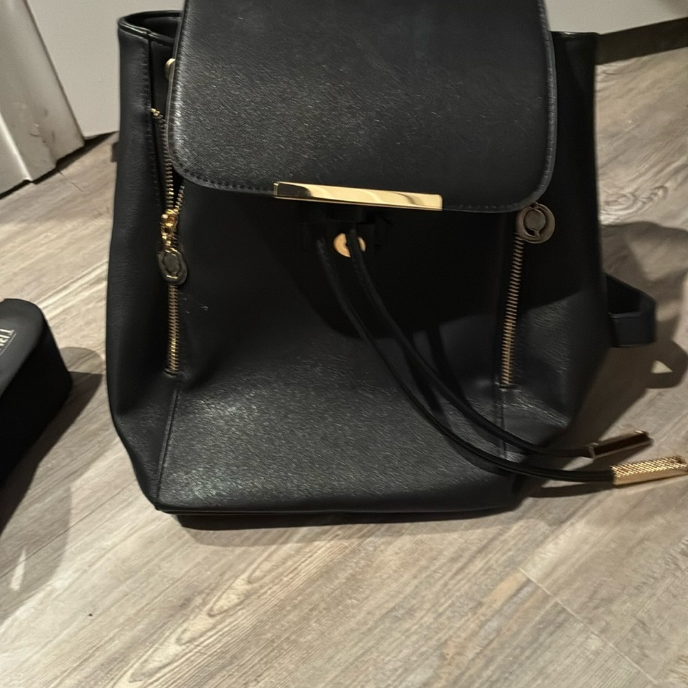 Sophisticated Black Leather Backpack with Gold Hardware